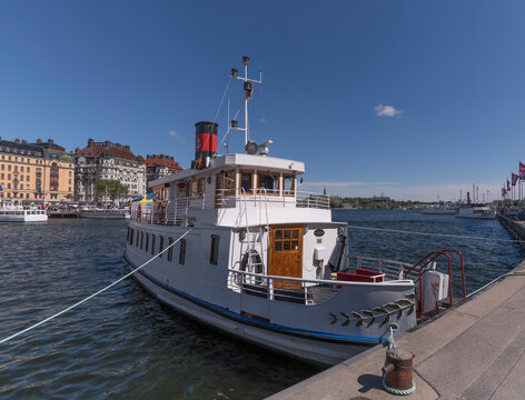 Old steam commuting boat Gustaf lll at the bay Nybroviken a sunny day in Stockholm