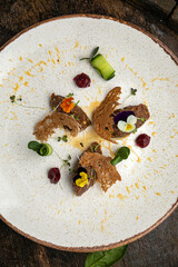 Meat tartat on a plate in a premium restaurant
