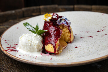 chocolate fondant with ice cream on a wooden table
