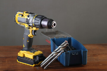 yellow screwdriver with drill bits