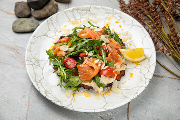 Salad with salmon, caviar, herbs, cherries