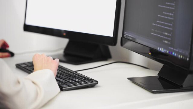 Scrolling the HTML web page code. Young female programmer