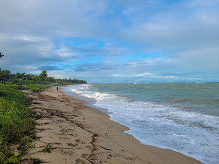 fisherman's beach with clouds and shy sun after rain, Arrial D'Ajuda, Bahia, Brazil