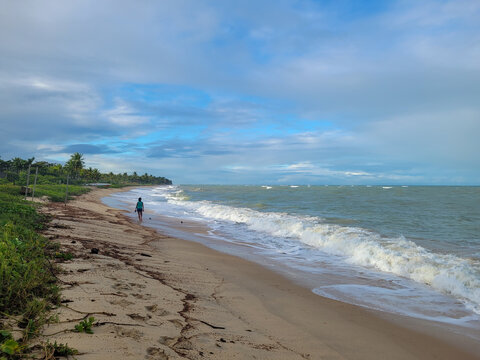 fisherman's beach with clouds and shy sun after rain, Arrial D'Ajuda, Bahia, Brazil