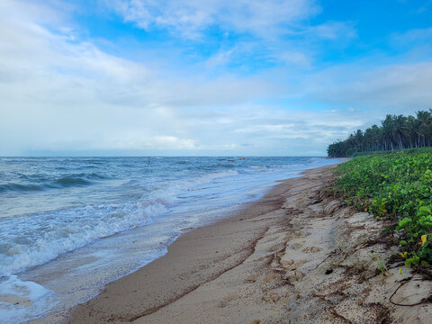 fisherman's beach with clouds and shy sun after rain, Arrial D'Ajuda, Bahia, Brazil