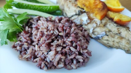 rice and fish on a plate