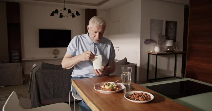 Elderly man eating delivery food