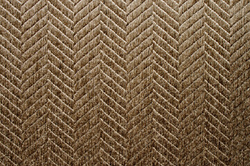 Fabric background. Sticky textured brown fabric with pattern close up. Fabric for the manufacture of fabric blinds or mat, wallpaper