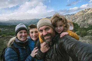Family making a selfie in the mountain
