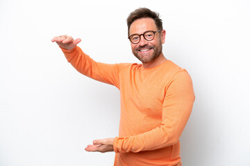 Middle age caucasian man isolated on white background holding copyspace to insert an ad