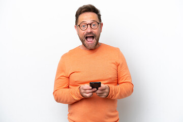Fototapeta premium Middle age caucasian man isolated on white background surprised and sending a message