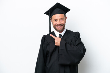 Middle age university graduate man isolated on white background pointing to the side to present a product
