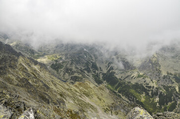 High Tatras natural rocky mountain landscape in low cloud and fog in Slovakia