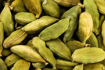 Green cardamom seed pods, close up, horizontal view