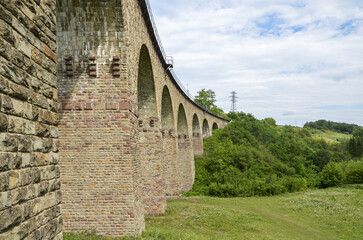 Ancient stone viaduct railway bridge built in the time of Austro-Hungarian Empire in Western Ukraine in Ternopil region in the village of Plebanivka