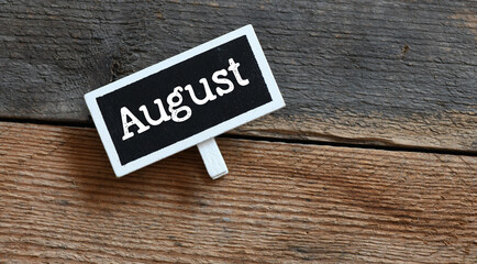 AUGUST on chalk board and table.