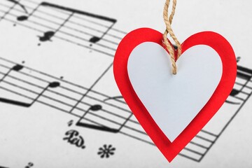 Small red heart with musical notes. Love to study music concept