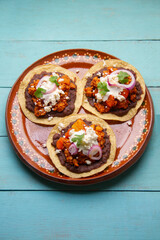 picadillo corn tostadas with cheese and beans. Mexican food