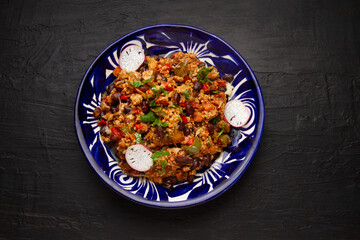 Chilli con carne in talavera plate. Mexican food
