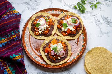 picadillo corn tostadas with cheese and beans. Mexican food
