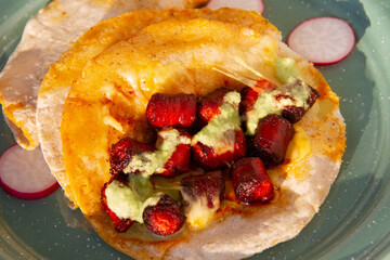 Chistorra quesadillas with green sauce. Mexican food