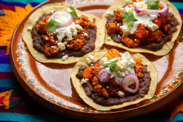 picadillo corn tostadas with cheese and beans. Mexican food