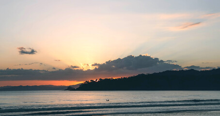 Sunset and a lonely surfer