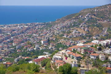 Fototapeta premium Turkey. Alanya. 09.21.21. View from a height of a resort town located near the Mediterranean Sea in the mountains.