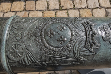 Historic Napoleonic artillery gun near Les Invalides in Paris. Les Invalides (National Residence of Invalids) - complex of museums and monuments relating to military history of France.