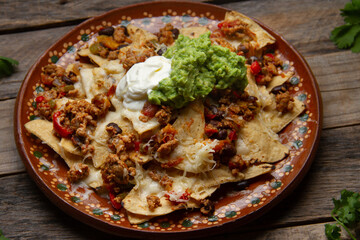 Nachos with guacamole and chilli con carne. Mexican food