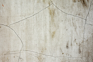 Old white concrete wall with stains and cracks, old concrete for background.