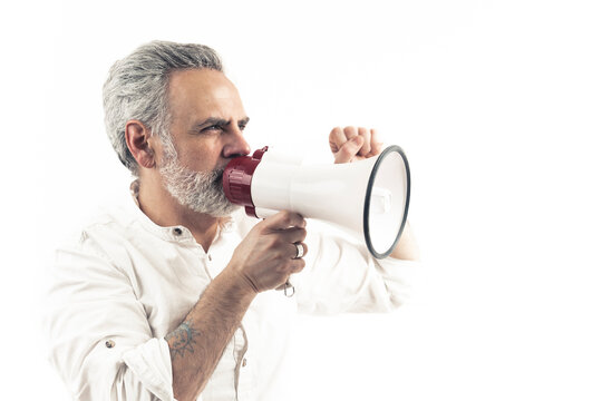 Caucasian middle-aged businessman encouraging people to protest by shouting via loudspeaker. Isolated over white background. High quality photo