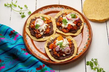 picadillo corn tostadas with cheese and beans. Mexican food