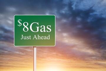 Obraz premium $8 Gas Green letter on Road Sign Against Cloudy Sky.