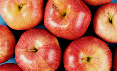 Group of fruit shows red ripe apples closeup from top view.