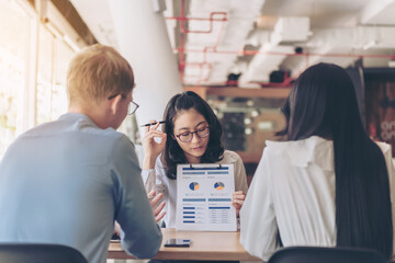 Working process startup. Businessman working at the wood table with new finance project. Modern notebook on table. Pen holding hand