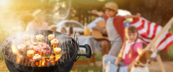 Barbecue grill with raw meat, mushrooms and corn outdoors