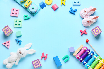 Frame made of educational toys on blue background