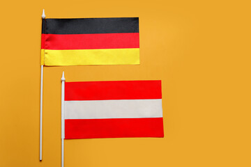 Flags of Germany and Austria on color background