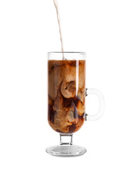 Pouring of milk into glass cup with iced coffee on white background