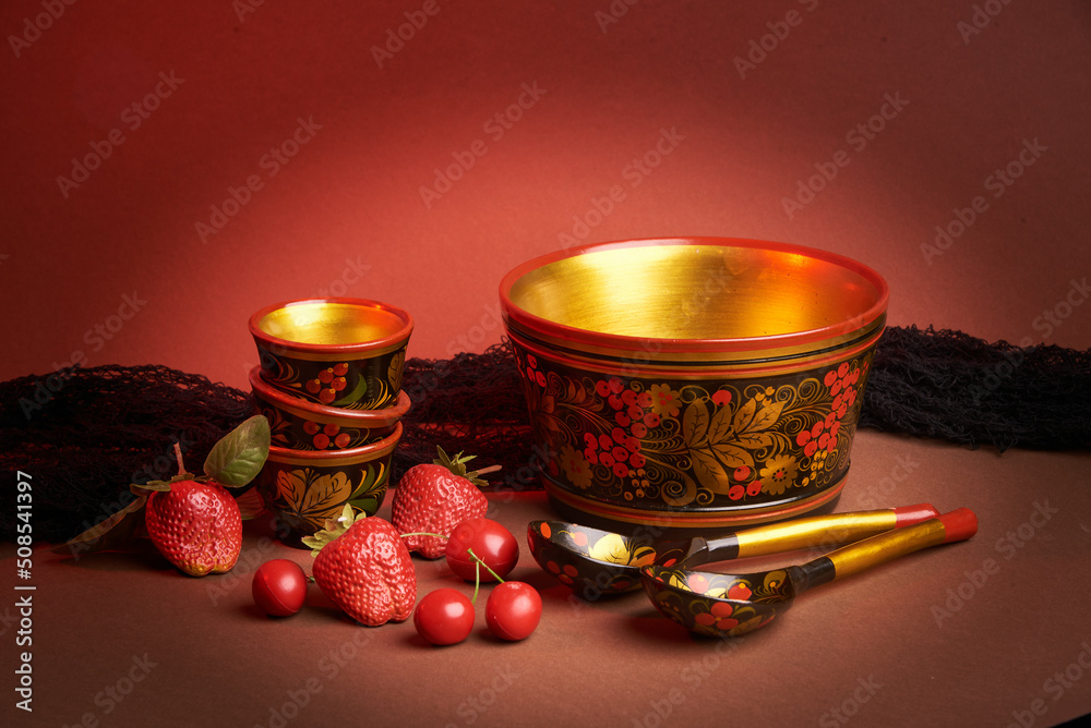 Wall mural Khokhloma, eating and spice traditional slavic woodwork and painting style of kitchenware, studio background