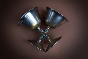 Two magical goblets crossed ready for casting spells or ceremony