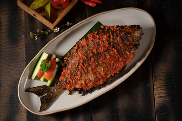 Spicy Sour Deep Fried Fish is Spicy and refreshingly sour, Pecak Ikan Baronang is a delicious seafood dish.