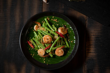 Green beans make for a healthy and easy side dish recipe when stir fried with shrimp, fresh ginger and onions. Soy sauce adds depth of flavor. Great for busy weeknights!