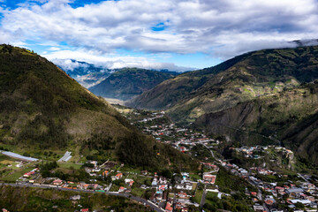 Fototapeta na wymiar The outskirts of Banos de Agua Sante, a small village located in a valley of the Andes mountain range in Ecuador, South America