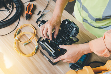  template Technician Fiberoptic Fusion Splicing. Worker connecting for Cable Internet signal and...