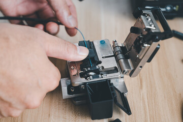  template Technician Fiberoptic Fusion Splicing. Worker connecting for Cable Internet signal and Wire connection with Fiber Optic Fusion Splicing machine,fiber optic cable splice machine in work