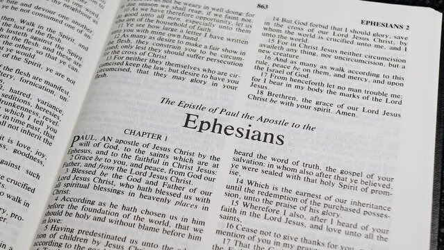 Close Up Shot of  Bible Page Turning to the book of Ephesians