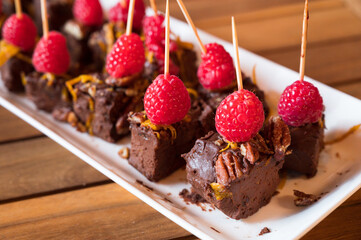 Fudge brownie and raspberry hors d'oeuvres, or appetizers....