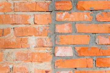 Fototapeta premium Wallpaper from a brick wall. Full screen red brick wall. Construction background